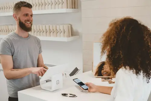 A shop owner with a customer